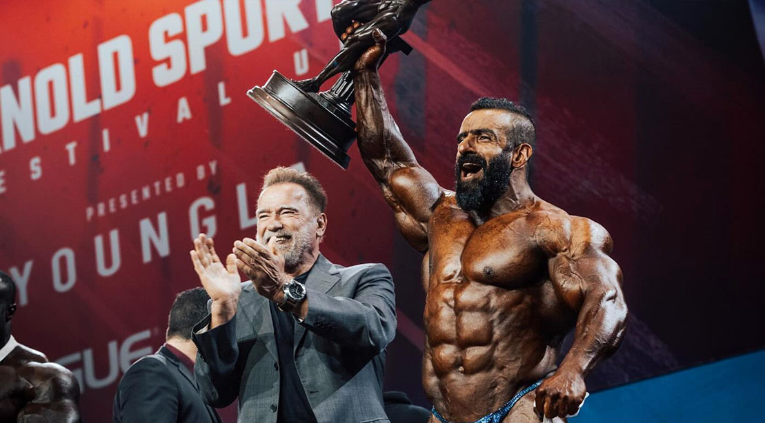 Arnold Schwarzenegger cheering on Hadid Choopin as he won the The Arnold UK